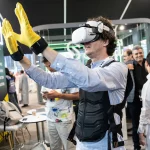 An attendee gets hands-on with the latest in virtual reality tech at LEAP, the world’s largest technology event, which attracted a record-breaking 172,000 attendees.