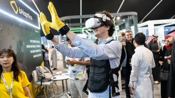 An attendee gets hands-on with the latest in virtual reality tech at LEAP, the world’s largest technology event, which attracted a record-breaking 172,000 attendees.